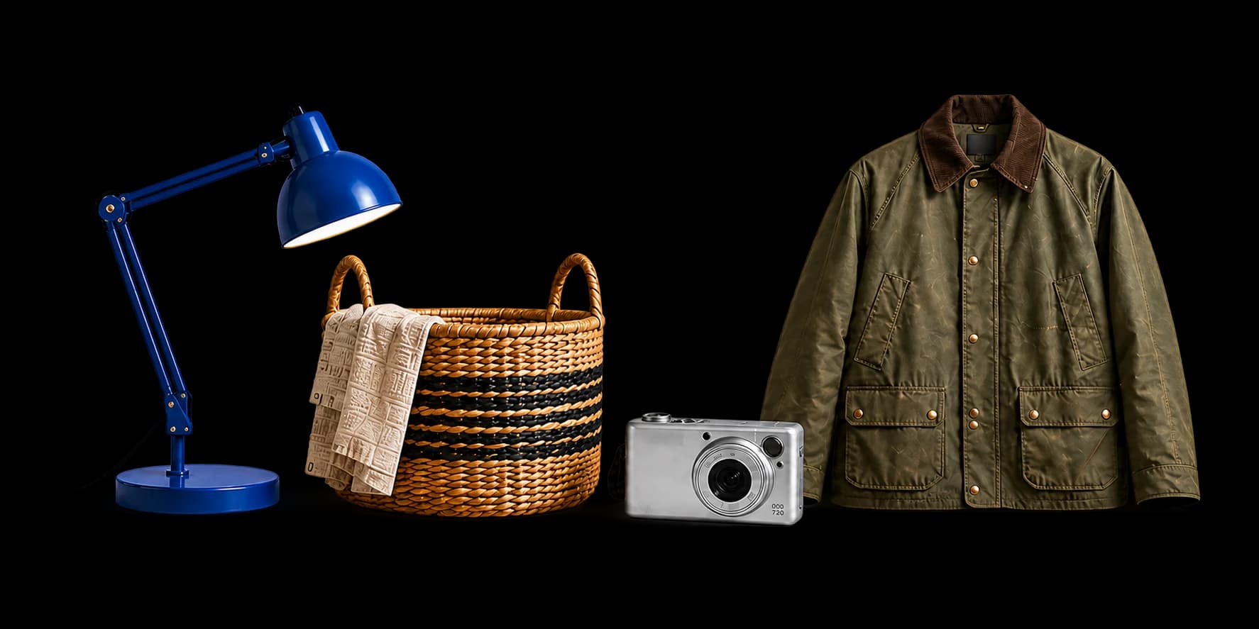 Task lamp, woven basket, camera, and waxed jacket